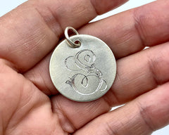 COIN WITH CARVED INITAL STERLING SILVER
