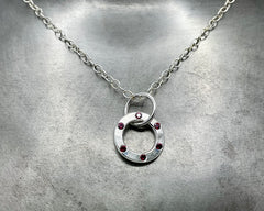 forged round amulet piccolo with red crystals sterling silver