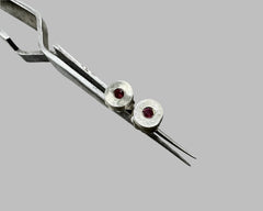 Forged round studs with garnets sterling silver