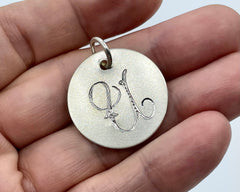 COIN WITH CARVED INITAL STERLING SILVER