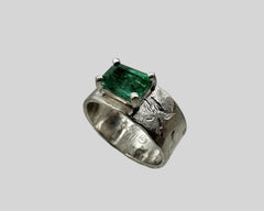 ERIN'S ENGAGEMENT RING PLATINUM AND EMERALD