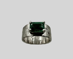 ERIN'S ENGAGEMENT RING PLATINUM AND EMERALD