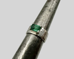 ERIN'S ENGAGEMENT RING PLATINUM AND EMERALD