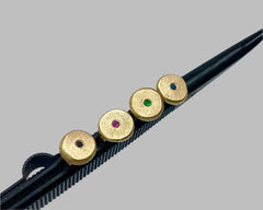 forged round studs with emeralds yellow gold