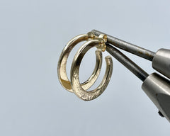 Forged crescent hoops yellow gold
